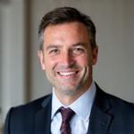 Kovács Zoltán, Vezérigazgató, mosolyogva néz a kamerába, professzionális portré.